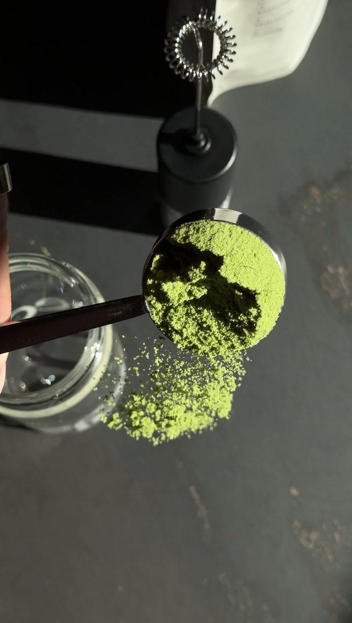 Scooping matcha powder